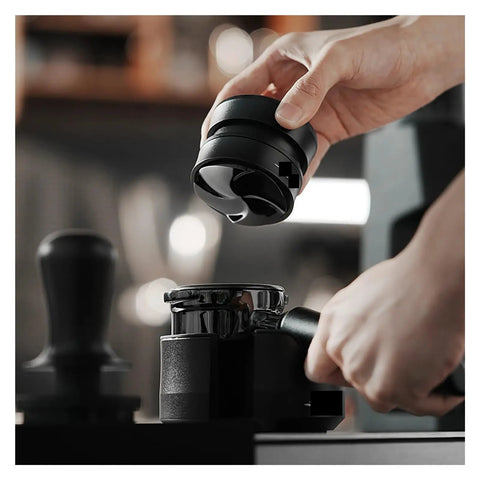 Hella Smooth Espresso Bed Leveler Cyclone Coffee Distributor Spinner for 51 58 mm portafilters being used to distribute coffee grounds.