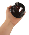Operitacx Black Metal MR16 Downlight Housing, Fits 1.57" Cut-Out, 3.3" OD, hand holding the black recessed spotlight trim.