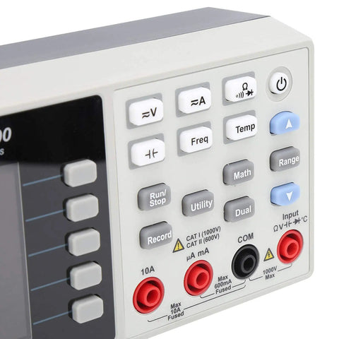 Close-up of a compact desktop multimeter control panel with 55000 counts and 3.7 inch LCD, showing buttons and inputs for testing.