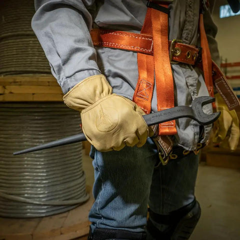 Worker holding Spud Wrench for 5/8 Inch Bolts and US Heavy Nuts, Heavy-Duty Alloy Steel Construction, safety gear visible