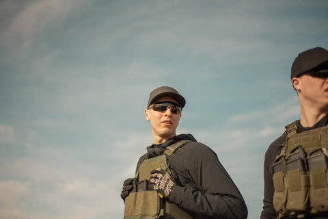 Heavy Duty Tactical Shooting Glasses For Men Featuring Anti Fog Lenses Ansi Z87.1 Certified Ballistic Safety Eyewear worn outdoors.