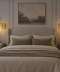 Modern Alabaster Wall Sconce - Natural Marble Wall Lamp with Luxury Brass Finish, hardwired decorative wall light in a bedroom.