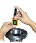 Hands using Dead Accurate Digital Leeb Pen Type Hardness Meter on metallic part, measuring hardness with OLED display.