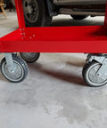 Set of four 6-inch heavy-duty swivel caster wheels on a red cart frame; gray wheels with braking mechanism.
