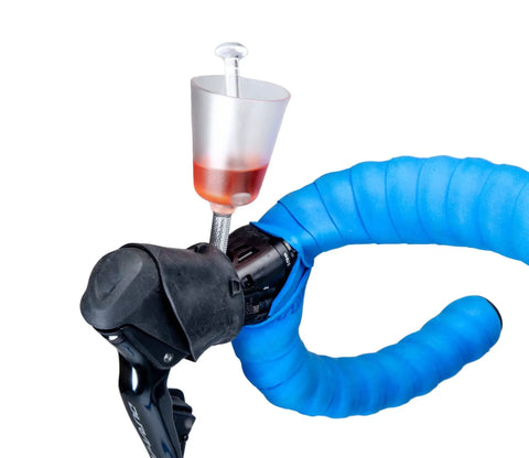 BKM12 Hydraulic Brake Bleed Kit For Mineral Oil shown with bleed funnel attached to bicycle handlebar brake lever.