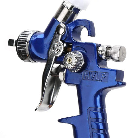 High Performance Pneumatic HVLP Gravity Feed Oil Paint Sprayer Hella Fine Atomization With Badass Overspray Control For Auto Body Furniture Panels And Creative Projects To Save Serious Cash On Supply close-up of nozzle and trigger mechanism.