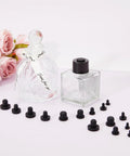 90 Pcs Silicone Rubber Hole Plugs Set With 9 Diameter Sizes next to glass bottles and flowers
