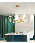 Modern Stainless Steel Creative LED Pendant Lamp Luxury Living Room Restaurant Bedroom Hotel Minimalist Chandelier Decor Light in dining area.