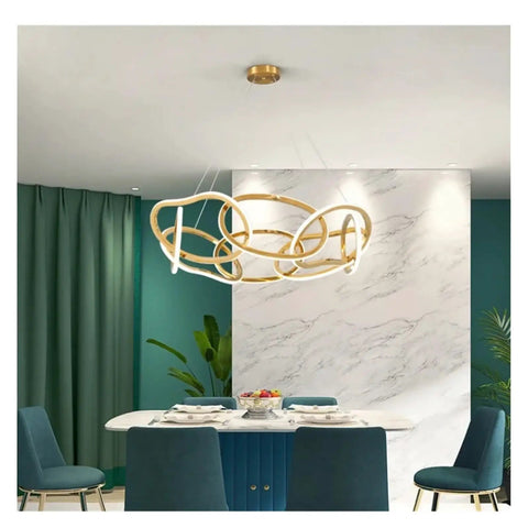 Modern Stainless Steel Creative LED Pendant Lamp Luxury Living Room Restaurant Bedroom Hotel Minimalist Chandelier Decor Light in dining area.