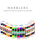 MARBLERS 11 oz liquid colorant bottles, water-based pigments, arranged in a colorful arc for concrete and plaster.