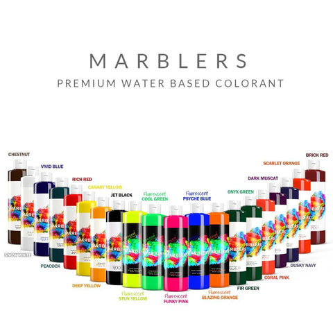 MARBLERS 11 oz liquid colorant bottles, water-based pigments, arranged in a colorful arc for concrete and plaster.