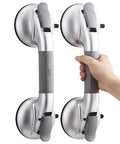 Rock Solid Shower Grab Bars With Grippy Suction Handles No Drill Bathroom Safety Rails Hold Up To 330 Lbs Upgraded Senior Assist Silver Two Pack Easy Install with a hand gripping one bar.