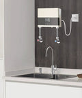 Top Tier Tankless Electric Water Heater With 110V Hot Water Delivery Featuring A Sharp Digital Display And Adjustable Wattage For Kickin Rapid Heating During Kitchen Or Bathroom Use installed above a modern kitchen sink.