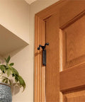 Two Point Two Inch Jumbo Hinge Pin Door Stop With Adjustable 85-125 Degrees, zinc alloy, matte black, installed on wooden door frame