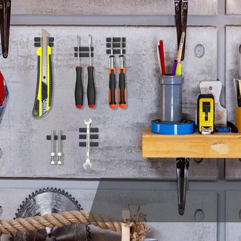 MIKEDE 20-pack neodymium magnet bars with adhesive, black epoxy coating, 60 x 10 x 3 mm, on a workshop wall