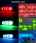 Under Cabinet RGB LED Puck Lights Kit With Wireless Remote Control 16 Color Dimmable Plug In Lights illuminating shelves and kitchen
