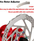 Disc rotor adjuster with All In One Bike Front And Rear Disc Brake Kit, showing stainless rotor and red component