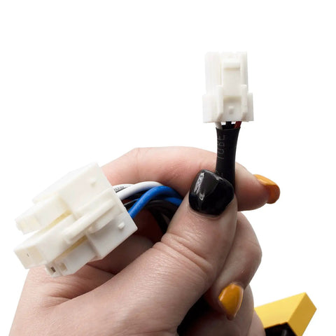 Close-up of connectors from Model-Specific Fridge Water Inlet Valve Assembly With Bracket And Harness For French Door Fridges That Need A Real Exact Fit Not Universal Includes Alternate Part Numbers AP4511357, 2010995, DA62-02291B, DA97-07827E, PS4175482 held in hand.