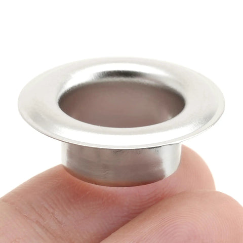 Close-up of a single metal grommet from the 3/4 Inch Grommet Tool Kit With Eyelet Setter And Hole Punch Cutter Includes 10 Durable Grommets.