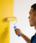 Person using Microfiber Paint Roller Covers 9 Inch 3/8 Inch Nap 12 Pack Pro Grade For Smooth Walls And Ceilings Shed Resistant And Washable