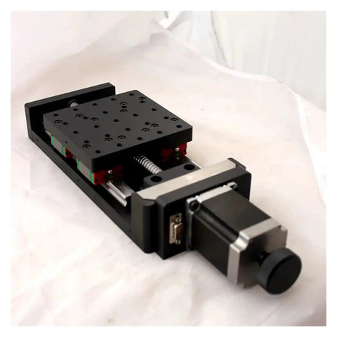 Top Shelf Precision Motorized Rotary Positioning Stage Featuring Slick Electric Linear Slide And Smooth Riding Worm Gear Drive For Heavy Duty Optics Setup Includes NT102TA500M Cross Module Rail System, viewed from the side showing the rail system and linear drive.