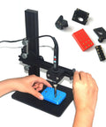 Heat Set Insert Tool Kit With 370 Brass Threaded Inserts for 3D Printing in use, showing installation on blue plastic base.