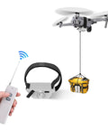 All Terrain Drone Airdrop System With Remote Release For Payload Delivery holding package using handheld remote control