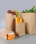 Kraft Paper Bags Khaki Party Favor Bags Set Of 50 Or 100 Pcs In 28x28x14 Cm Eco Friendly Gift Bags filled with bread, fruit, and plants