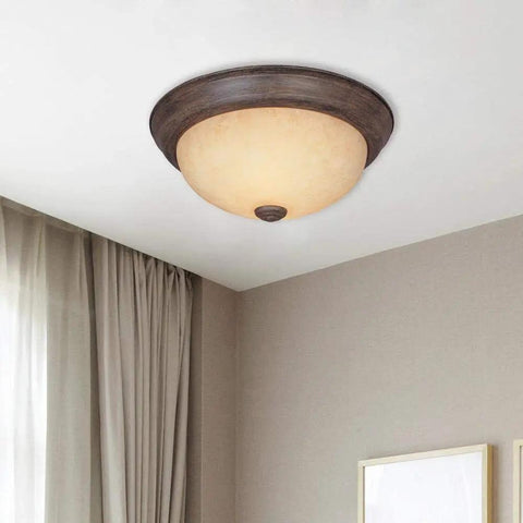 Rustic 15 Inch 3 Light Flush Mount Ceiling Fixture In Warm Mahogany With Amber Glass Shade in modern living room setting.
