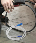 Mechanic using Must Have Brake Bleeder Hose Kit For Cars And Bikes, 5 16 Inch High Temp Silicone Tubing, on workshop floor