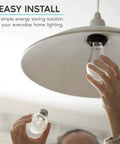 Person installing Super Bright A19 LED Bulbs 100 Watt Equivalent Dimmable 3500K Natural White 1600 Lumens in ceiling fixture
