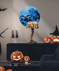 Light Up Skeleton Table Lamp With Four Bone Skull Design, LED 3D Skeleton Night Light in a Halloween-themed room.