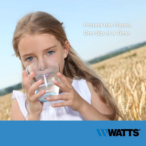 Young girl drinking water from a glass with field background, promoting clean water message by Watts.