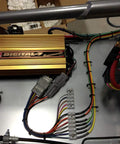 2 Pin Waterproof 18AWG Wire Connector Kit installed with wiring and terminals linked to a Digital-7 ignition system on a vehicle.