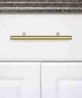Euro Bar Cabinet Pulls for Kitchen Drawers in Golden Champagne Finish, Sleek Five and One Half Inch Length, mounted on white cabinet