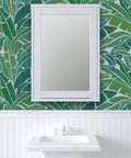 Heavy Duty Tropical Leaf Exotic Textured Vinyl Wallpaper, Slick Leather Finish Wall Covering For Walls above a white sink and mirror.