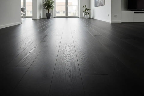 Pro Grade Black Bogwood Reactive Water Based Interior Wood Stain In A Heavy Duty 55 Gallon Drum on sleek black hardwood flooring.