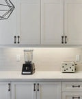 White kitchen with 10 Pack Matte Black 3 Inch Hole Centers Cabinet Pulls on cabinets and drawers.