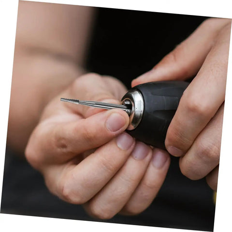 Hand holding a drill with a tungsten carbide bit from 3Pcs Tungsten Carbide Auto Glass Repair Drill Bit Kit for Windshield Chips and Cracks Easy Quick Fix for Car Windows Versatile Durable Glass Repair Tool Set