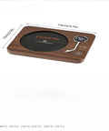 Game Changing Desk Essential Smart Electric Coffee Heated Coaster With Precise Thermostatic Heat Control Adjustable From Forty To Seventy Five Degrees showing dimensions 12cm x 15cm.