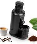 Real Deal 80Mm Flat Burr Coffee Grinder in matte black with espresso cup, coffee beans, and ground coffee.