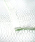 Close-up of woven fiberglass material from Must Have Large Emergency Fire Blanket Kit For Home And Kitchen.
