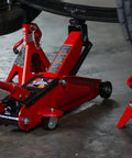 Torin Hydraulic Trolley Floor Jack 2.5 Ton Capacity With Blow Mold Carrying Case, Heavy Duty Steel Construction in use under car