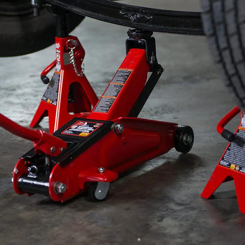 Torin Hydraulic Trolley Floor Jack 2.5 Ton Capacity With Blow Mold Carrying Case, Heavy Duty Steel Construction in use under car