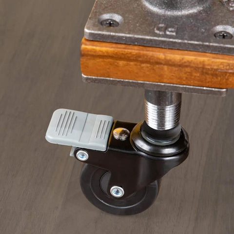Swivel Caster Wheels For Three Quarter Inch Pipe Four Pack With Locking Mechanism installed on table leg