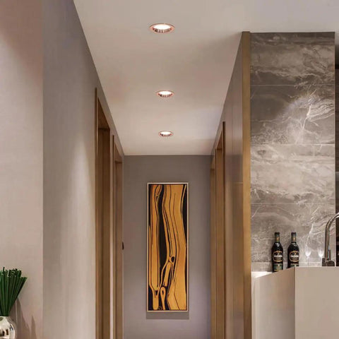 UWYTGF Retrofit Led Recessed Lighting installed in a modern hallway, highlighting artwork with dimmable can lights.