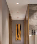 XYIANG Led Recessed Lighting showcased in a modern hallway, featuring round aluminum downlights with baffle trim.