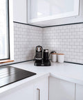 Modern kitchen with Peel And Stick Backsplash Tile Edge Trim 10 Ft Self Adhesive Corner Liner In Black PVC Trim For No Fuss Easy DIY Install.