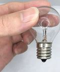 Person holding S11 Shape 25 Watt E17 Intermediate Base Lava Lamp Replacement Bulb 120 Volt Dimmable 2700K Warm White