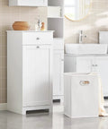 Slim Tilt-Out Laundry Hamper Cabinet For Tight Spaces in white finish, with pull-out drawer and tilting basket, in bathroom setup